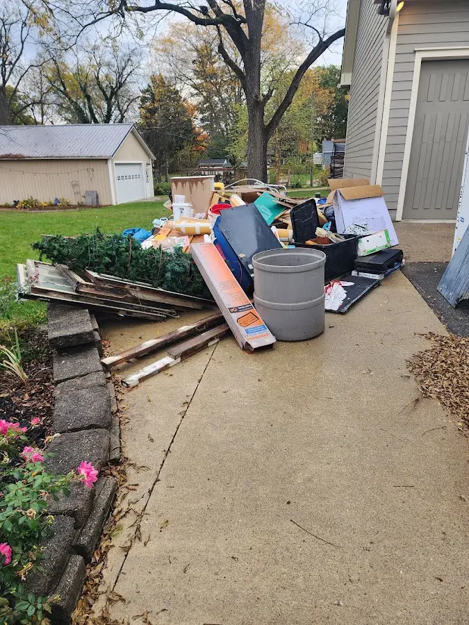 Dumpster being loaded with debris for 30 Yard Dumpster Rental in Roseburg